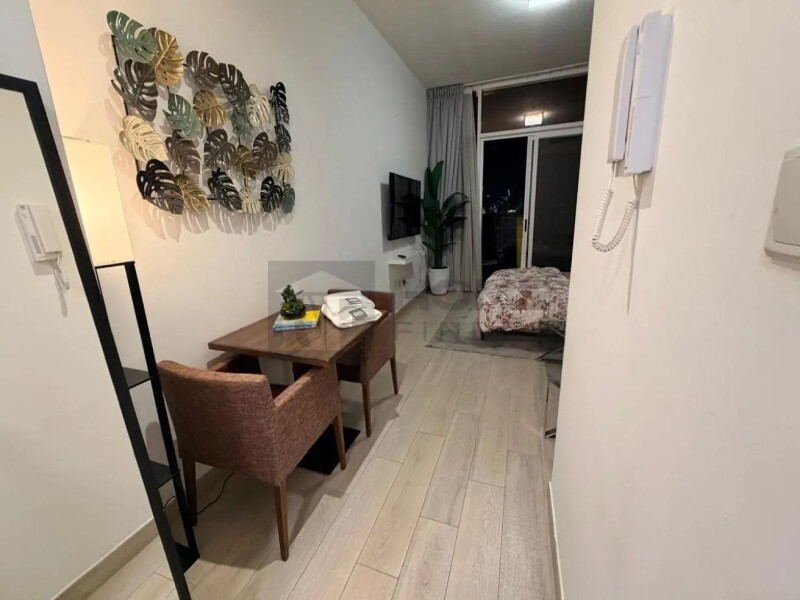 Apartment for Rent in Bloom Tower C - Jumeirah Village Circle, Dubai - Large Furnished Studio I Prime Location & Premium at 59000 AED