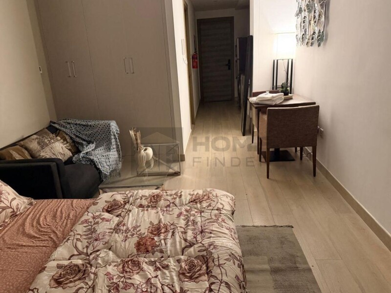 Apartment for Rent in Bloom Tower C - Jumeirah Village Circle, Dubai - Large Furnished Studio I Prime Location & Premium at 59000 AED