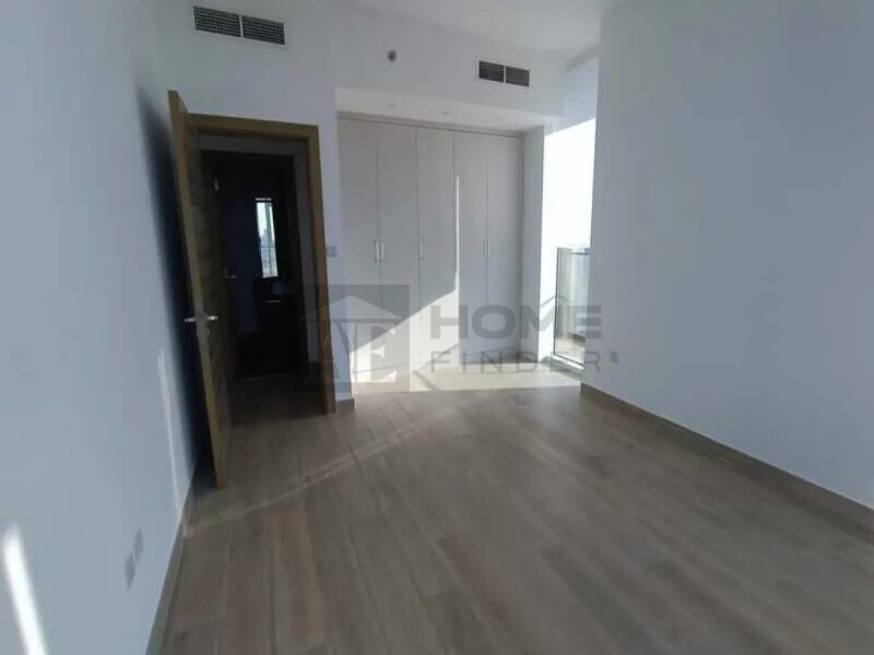 Apartment for Rent in Bloom Tower A - Jumeirah Village Circle, Dubai - Unfurnished 2BR | Prime location | Ready to move at 134999 AED