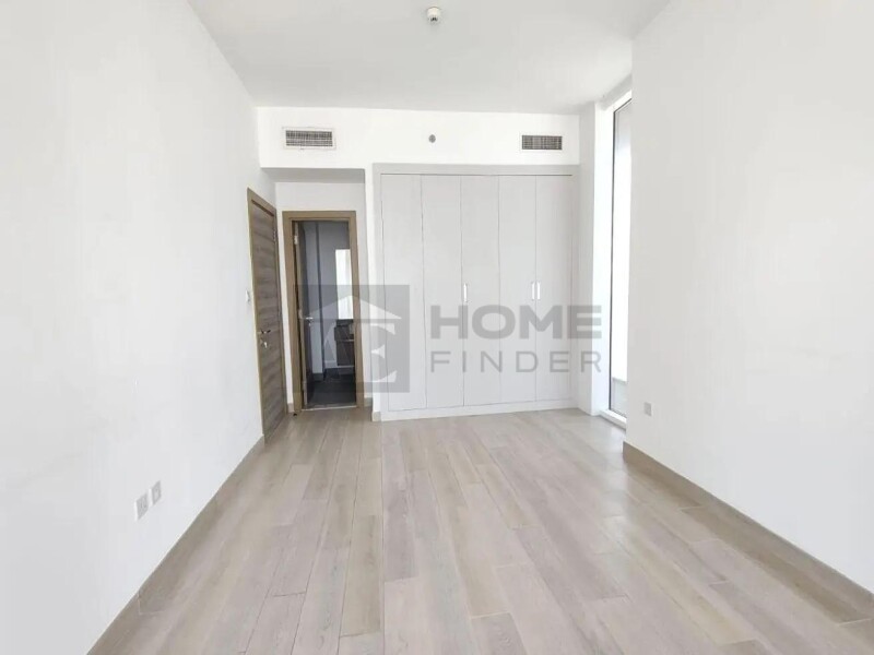 Apartment for Rent in Bloom Tower A - Jumeirah Village Circle, Dubai - Unfurnished 2BR | Prime location | Ready to move at 134999 AED